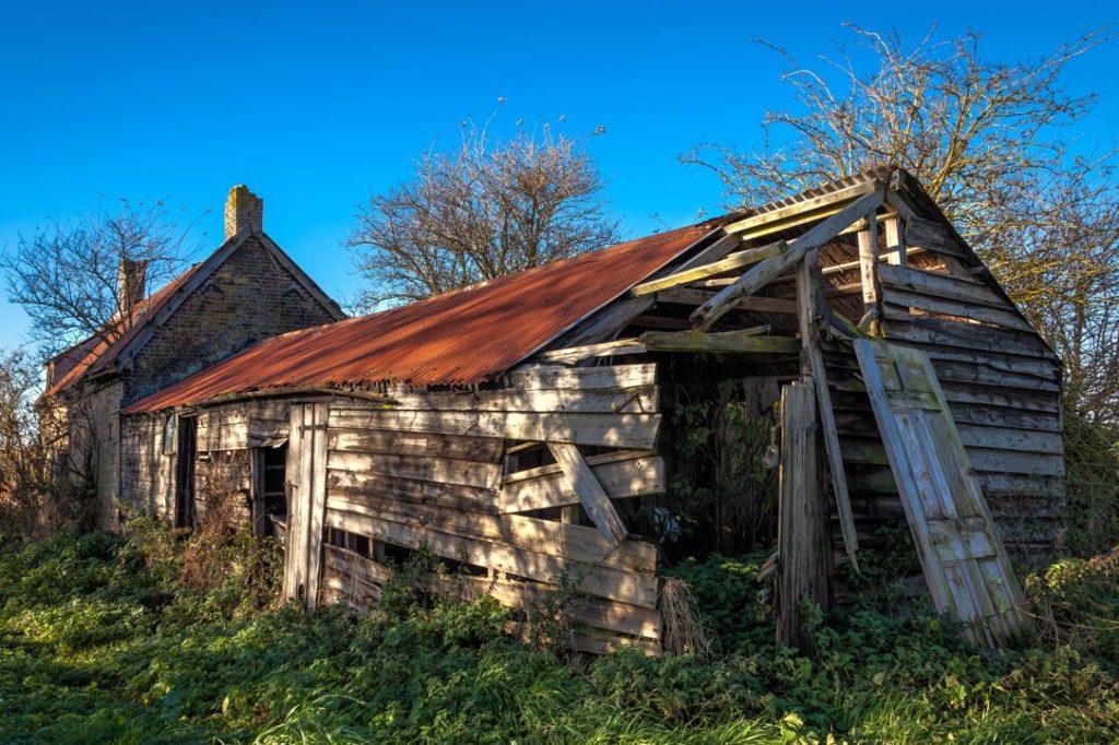 Derelict farmhouse and outbuildings in Cambridgeshire