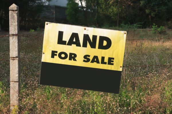 Signboard showing a message of land for sale